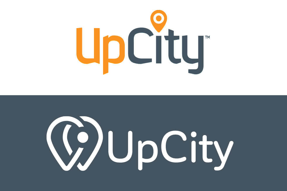 A comparison image of the almost-final new UpCity logo and the old UpCity logo.